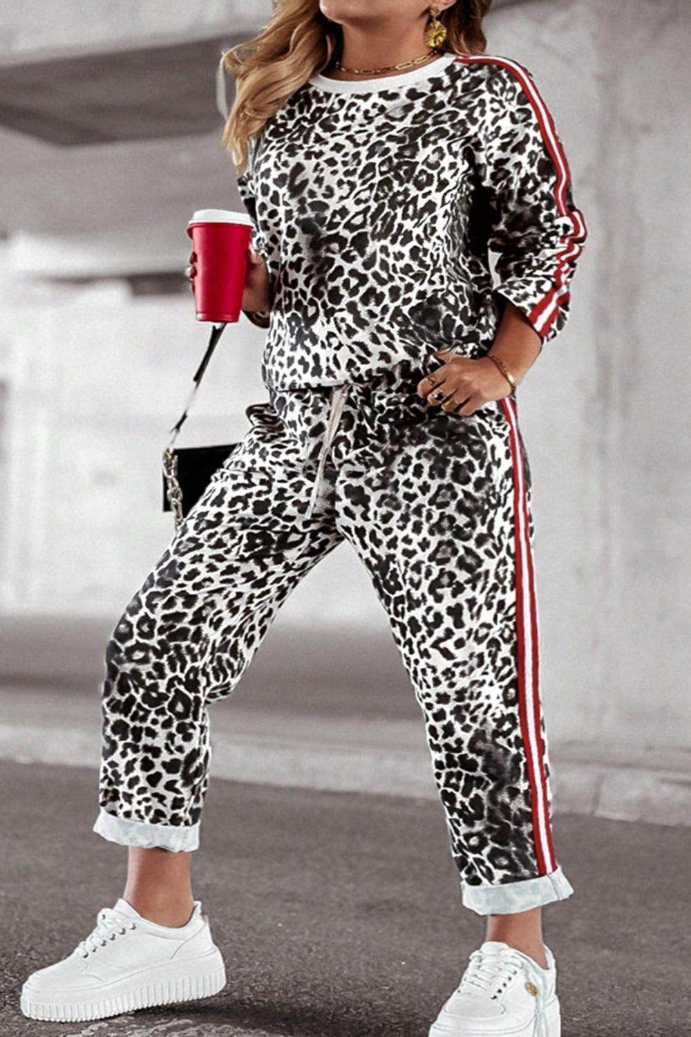 Plus size leopard print round neck top and matching pants set for women, casual and stylish by Trendsi.