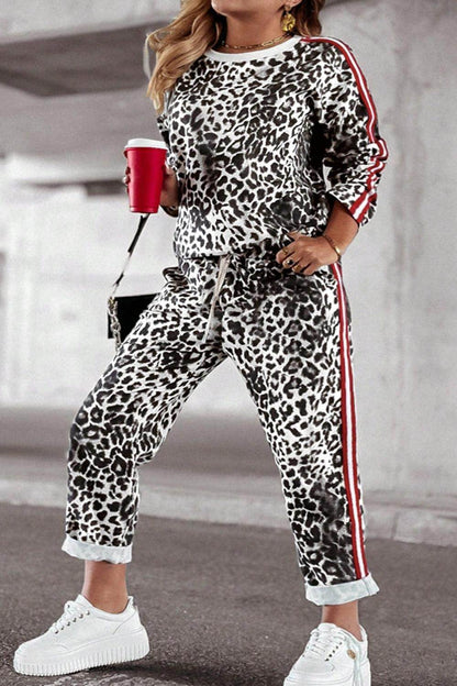 Plus size leopard print round neck top and matching pants set for women, casual and stylish by Trendsi.