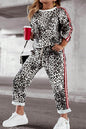 Plus size leopard print round neck top and matching pants set for women, casual and stylish by Trendsi.