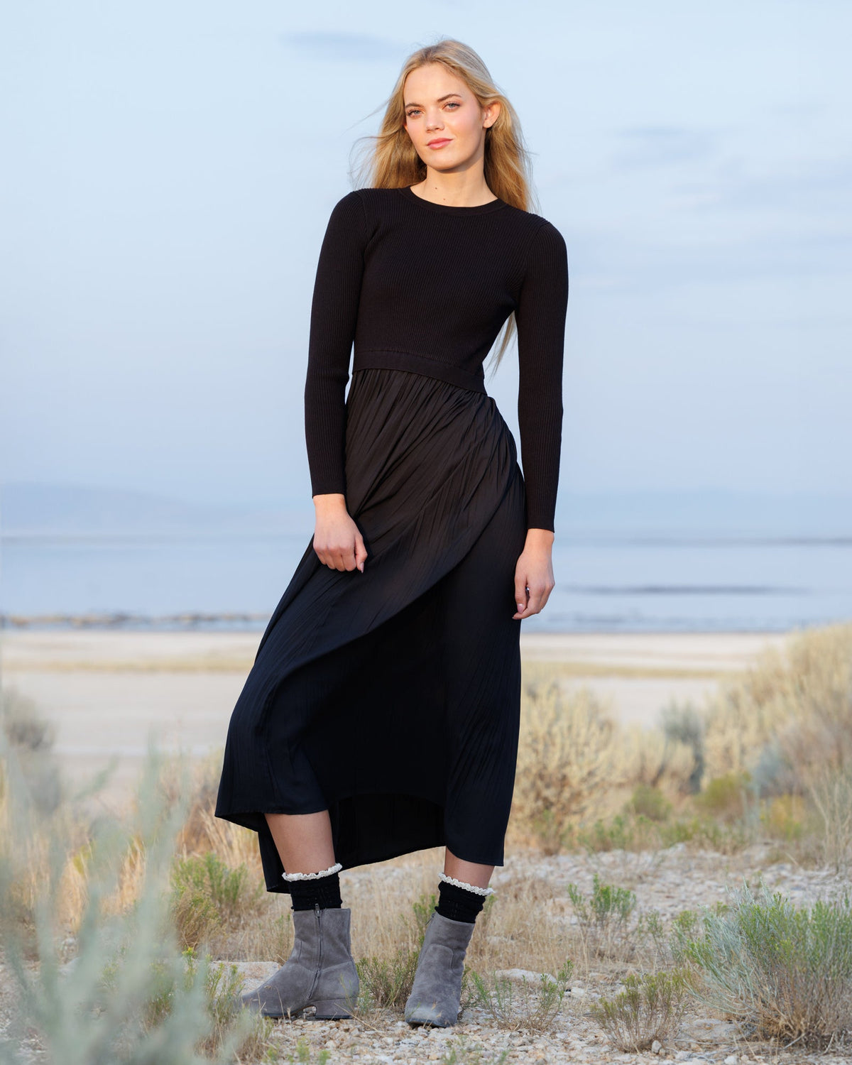 Downeast Soho Satin Dress displayed on a hanger, featuring a silky fabric and elegant design perfect for formal occasions.