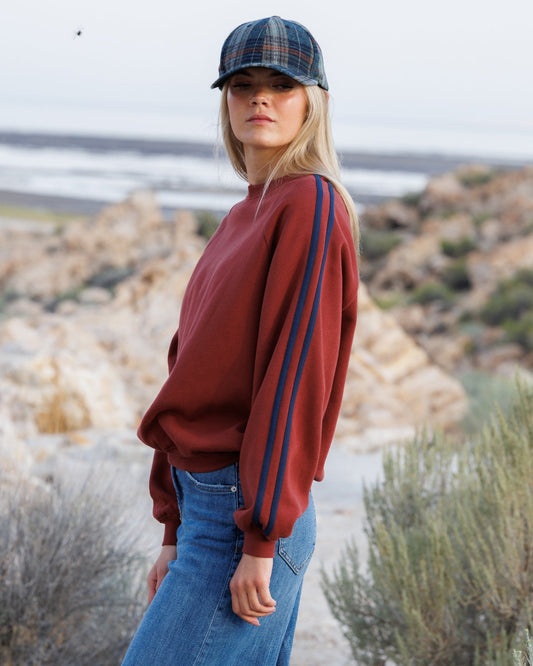 Downeast Retro Stripe Crew top featuring bold colorful horizontal stripes and a comfortable crew neckline.