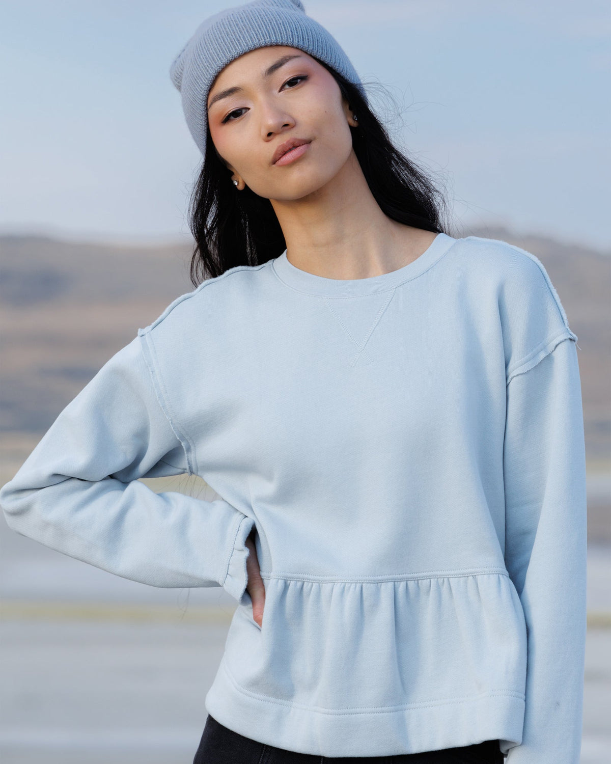 Downeast Country Peplum Crew top, casual women's blouse with a fitted waist and short sleeves, in a neutral color.