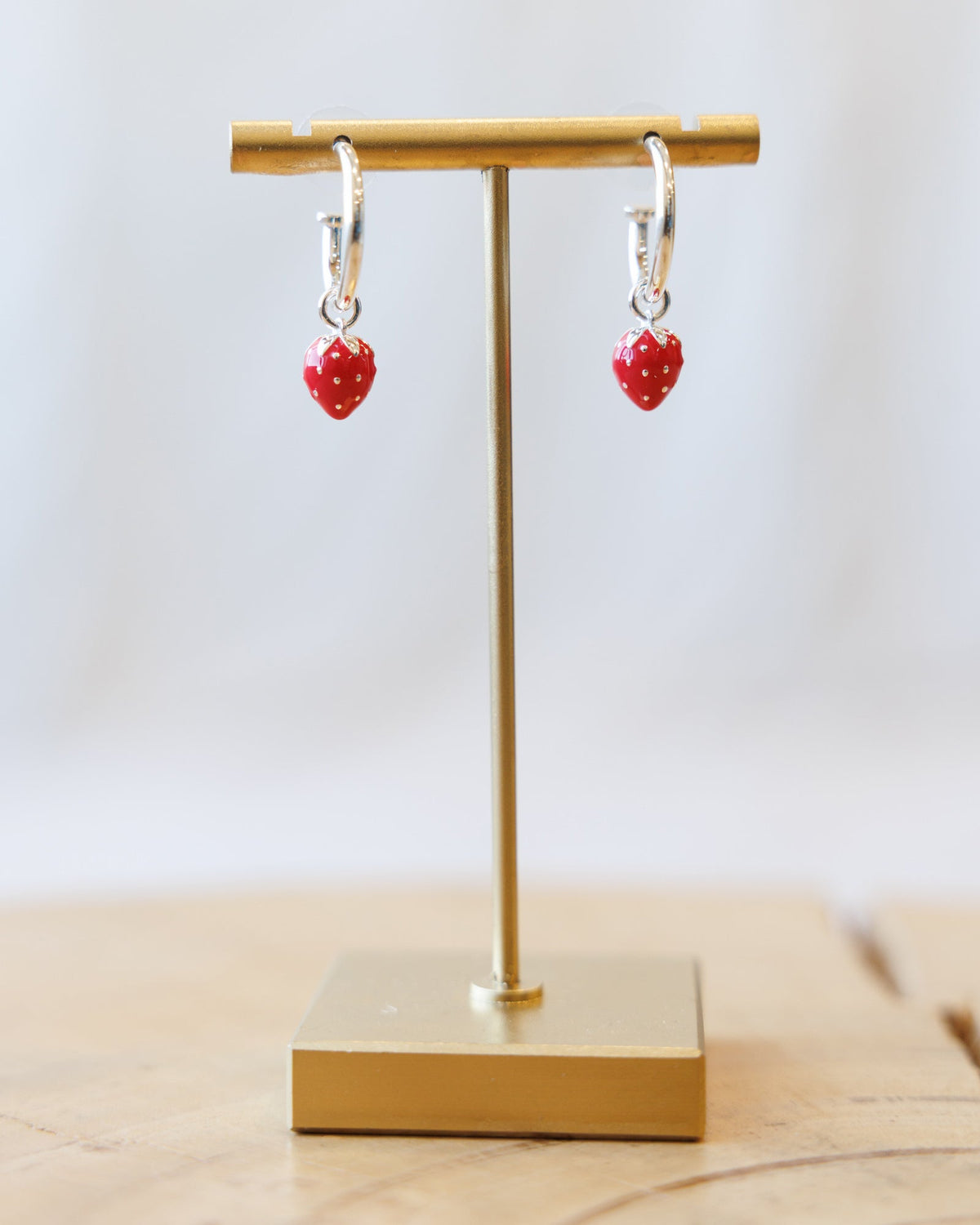 Silver Strawberry Fields Forever earrings by Downeast with detailed strawberry design and polished finish.