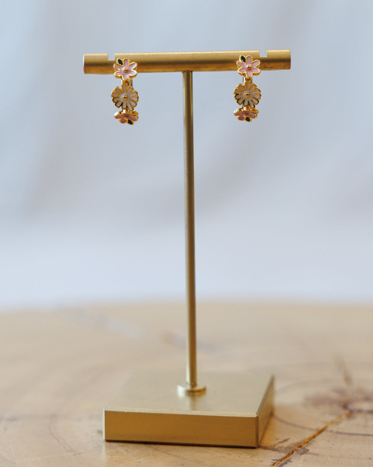 Downeast Summer Blooms Huggie Hoop Earrings featuring colorful floral design and gold-tone metal.