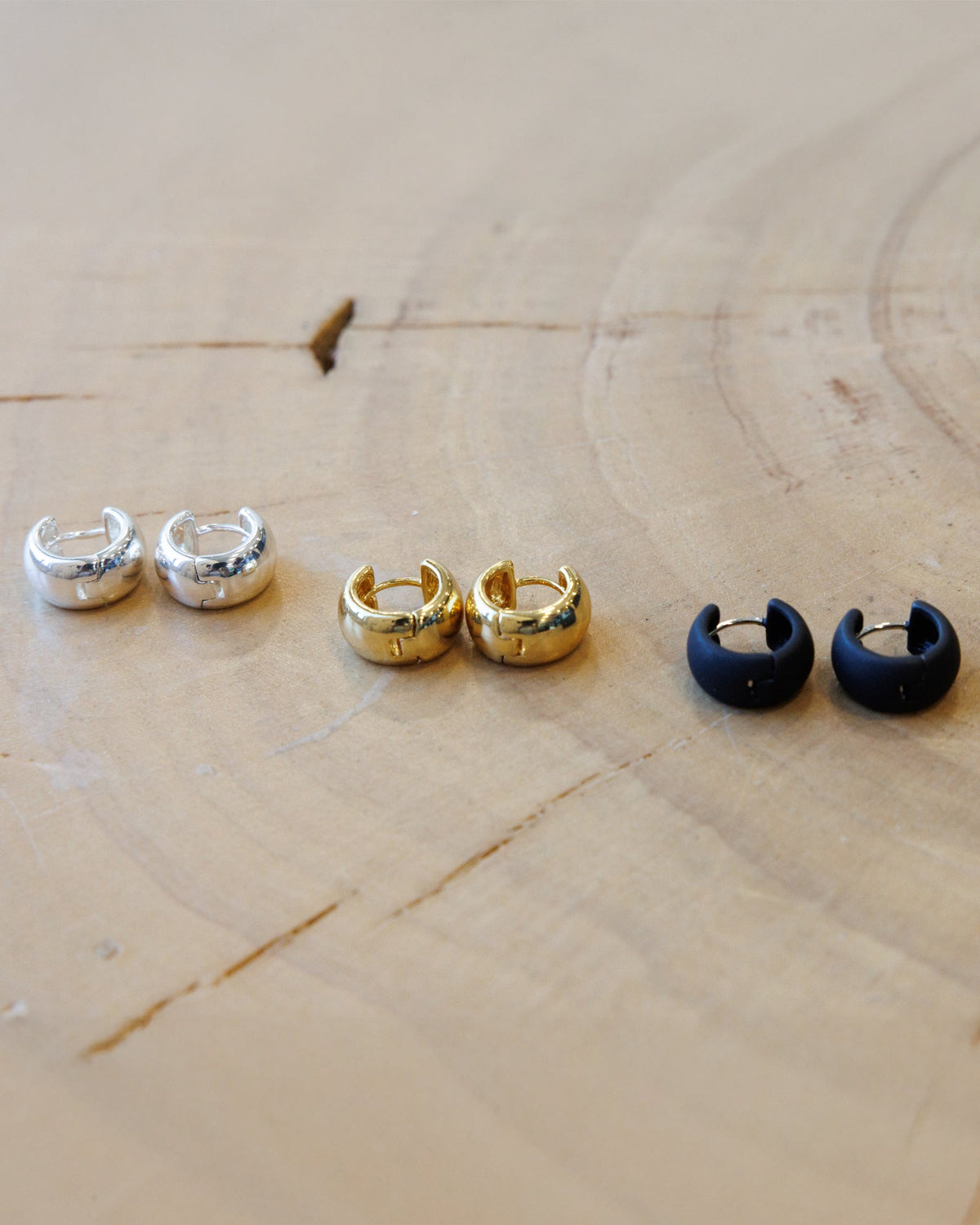 Downeast everyday earrings set featuring multiple stud and hoop earrings on a white background.