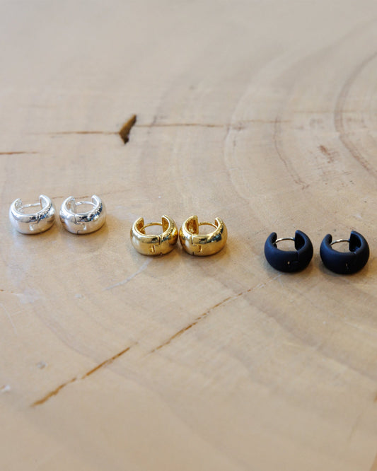 Downeast everyday earrings set featuring multiple stud and hoop earrings on a white background.