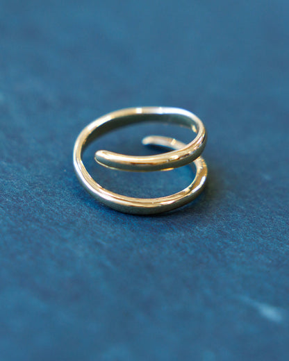 Downeast sculptured statement ring with intricate textured design, showcasing a bold, artistic jewelry piece on a neutral background.