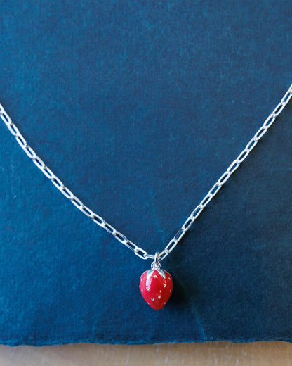Silver Strawberry Fields Forever necklace by Downeast featuring a delicate strawberry charm on a sleek chain.