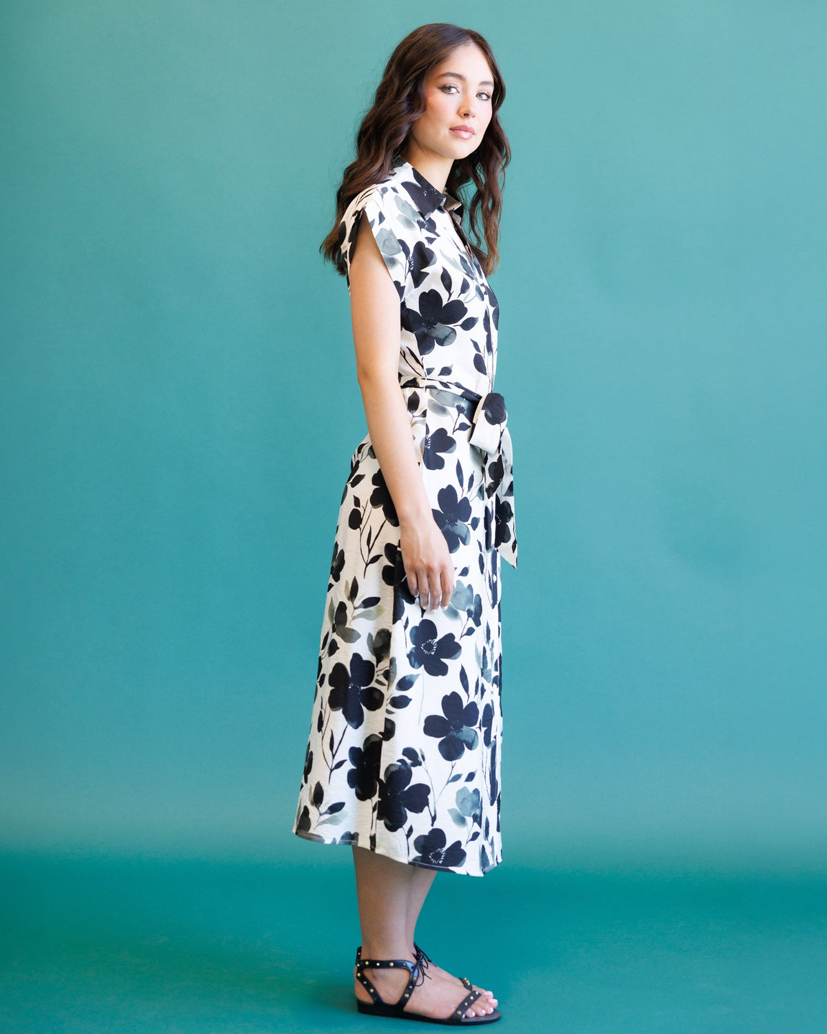 Downeast Quintessential Dress in a flowy fabric with a fitted waist and short sleeves, displayed on a hanger.