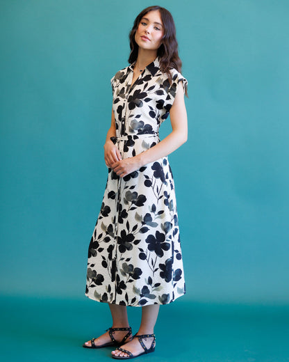 Downeast Quintessential Dress featuring a flowy silhouette and floral pattern, perfect for casual or semi-formal occasions.
