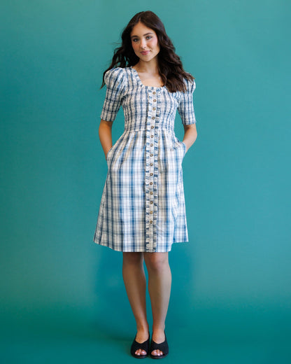 Downeast Oxford dress displayed on a hanger, featuring a classic button-up style with a collar and long sleeves.