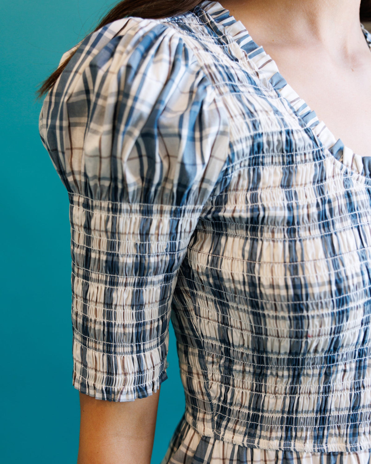 Downeast Oxford dress displayed on a model, showcasing its classic collar, button-down front, and casual yet stylish design.