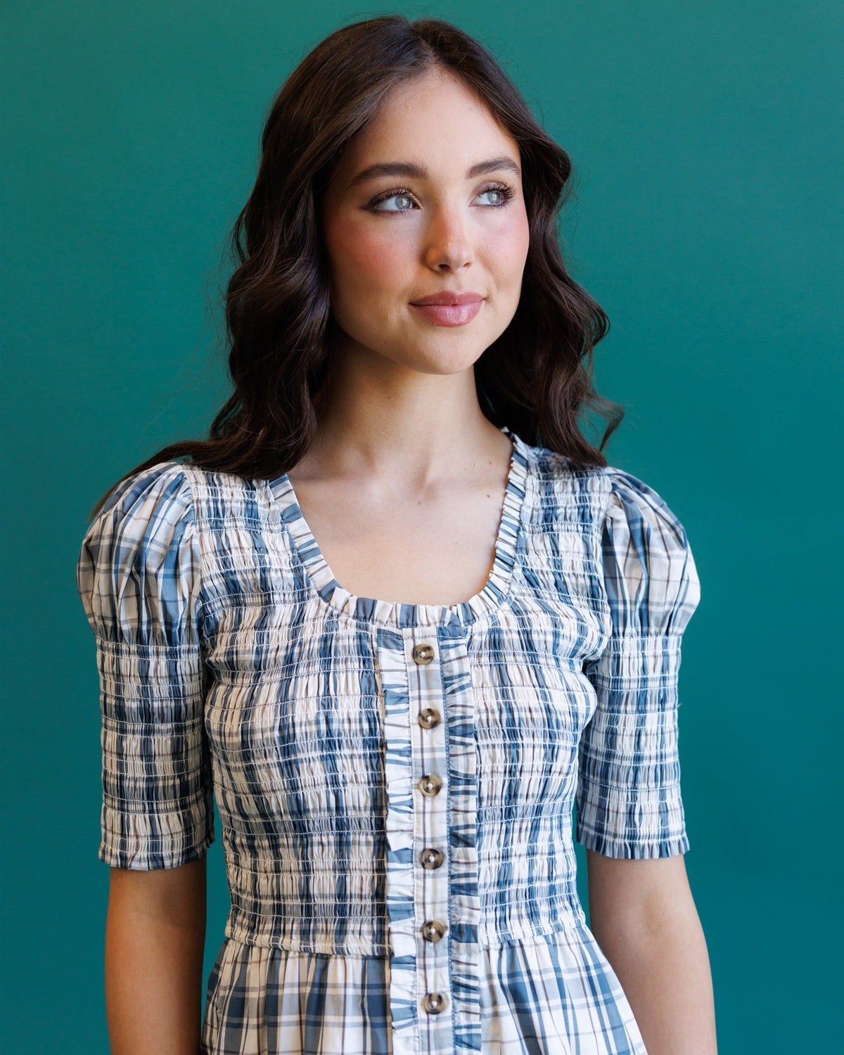Downeast Oxford dress displayed on a hanger, featuring a classic button-down design with a collar and long sleeves.