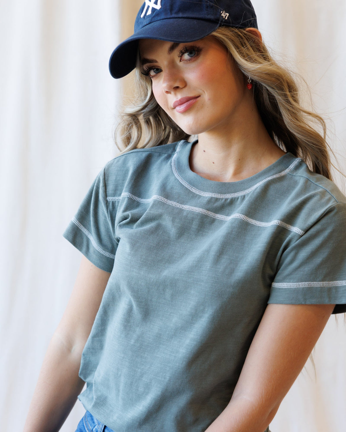 Downeast cheer section tee in vibrant colors, casual tops for cheerleaders with bold printed design and comfortable fit.