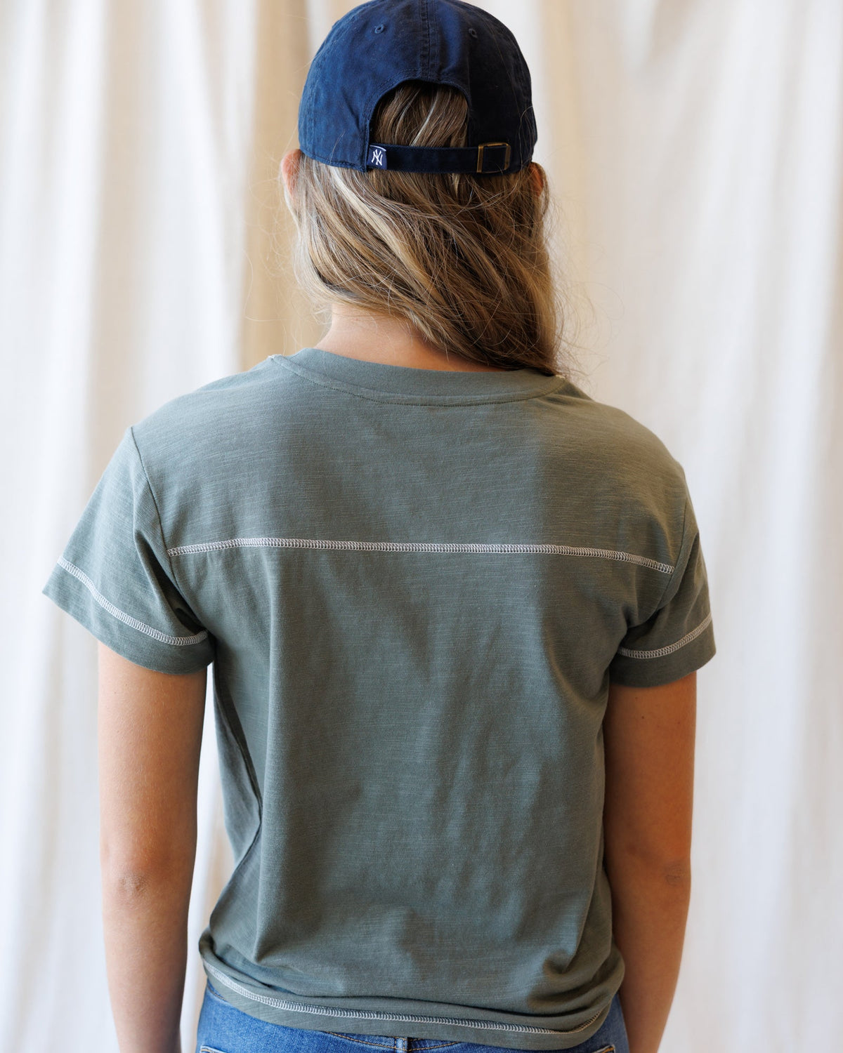 Downeast Cheer Section Tee, casual tops, featuring a comfortable fit and cheerleading-inspired design on a light-colored fabric.