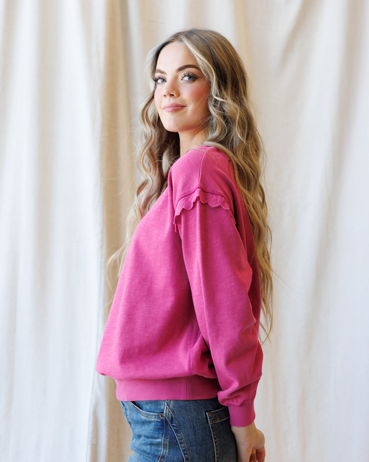 Downeast Prep & Pretty Pullover, stylish women's top in soft fabric with a relaxed fit and ribbed cuffs, displayed on a hanger.
