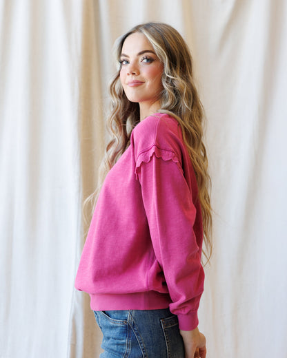 Downeast Prep & Pretty Pullover, stylish women's top in soft fabric with a relaxed fit and ribbed cuffs, displayed on a hanger.