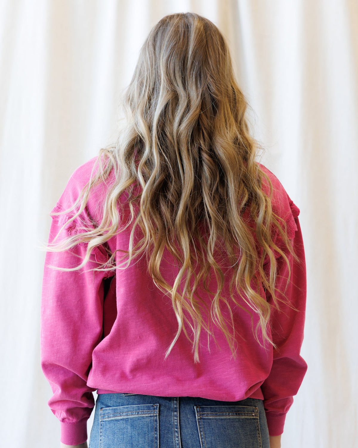 Downeast Prep & Pretty Pullover top in soft fabric, featuring a relaxed fit and stylish design, displayed on a hanger.