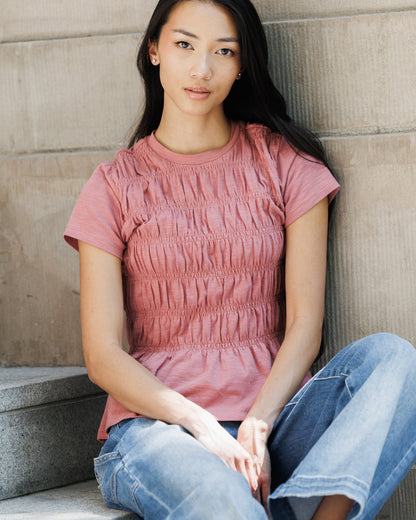 Downeast smocked tee top featuring a fitted style with smocked detailing and short sleeves, perfect for casual wear.
