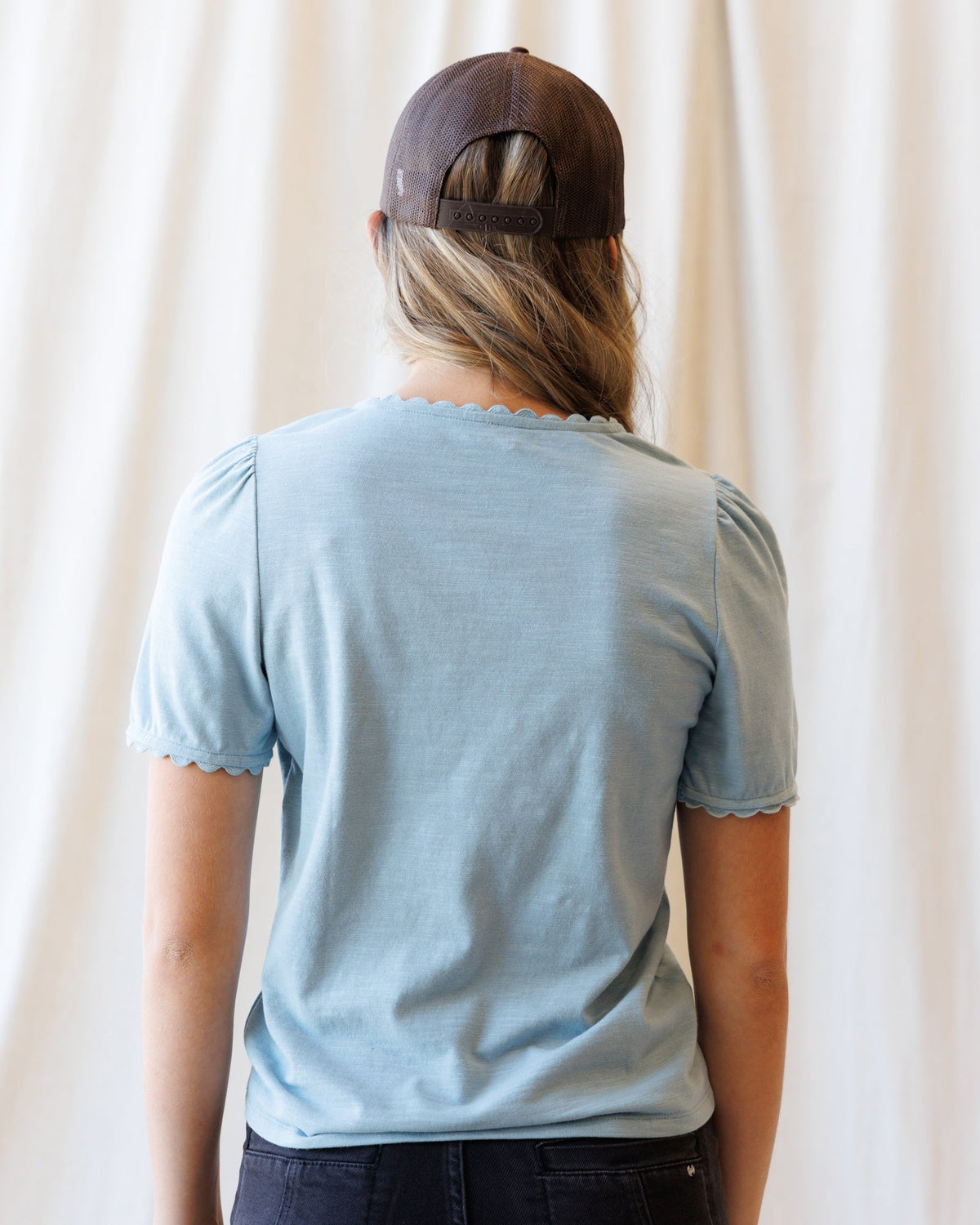 Downeast scallop tee top in soft fabric with a scalloped neckline, styled with casual accessories.