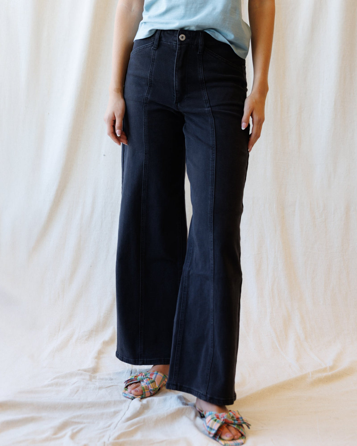 Downeast high rise seamed denim trousers, front view showing classic design and tailored fit.