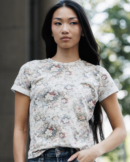 Downeast Go Floral Tee, women's tops with a vibrant floral pattern and casual fit, shown on a hanger against a neutral background.