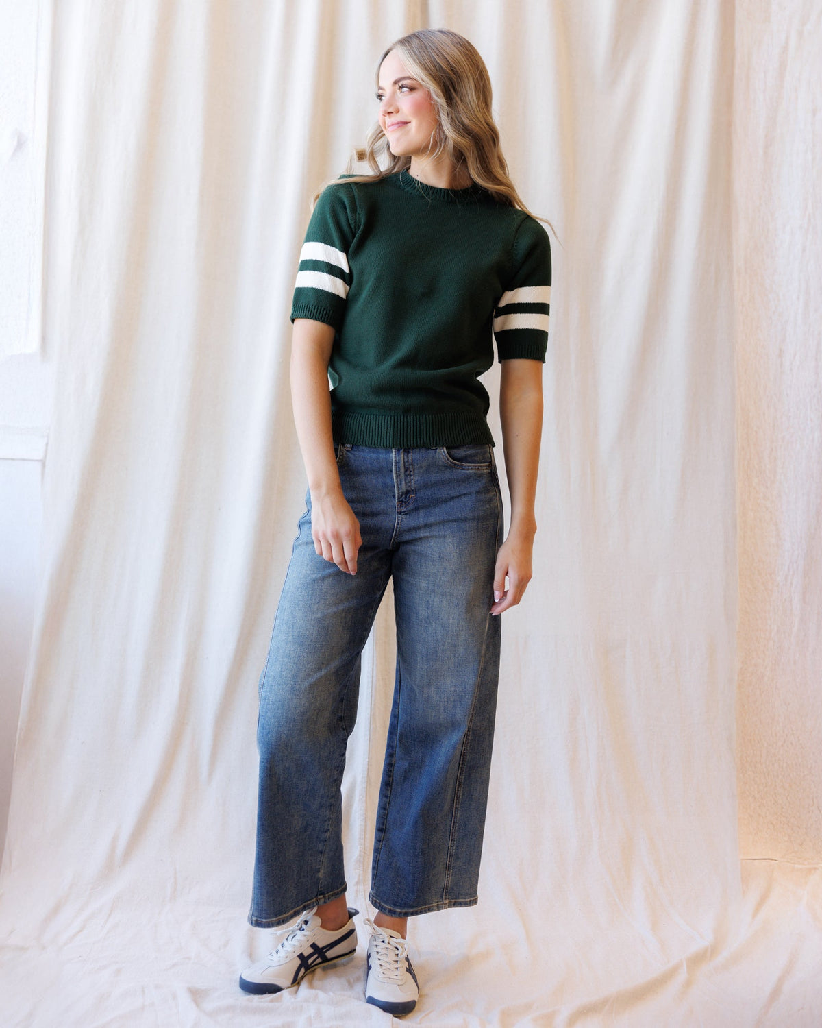 Downeast Team Spirit Crew sweater in heather gray with team logo, soft knit fabric, crew neck, and long sleeves.