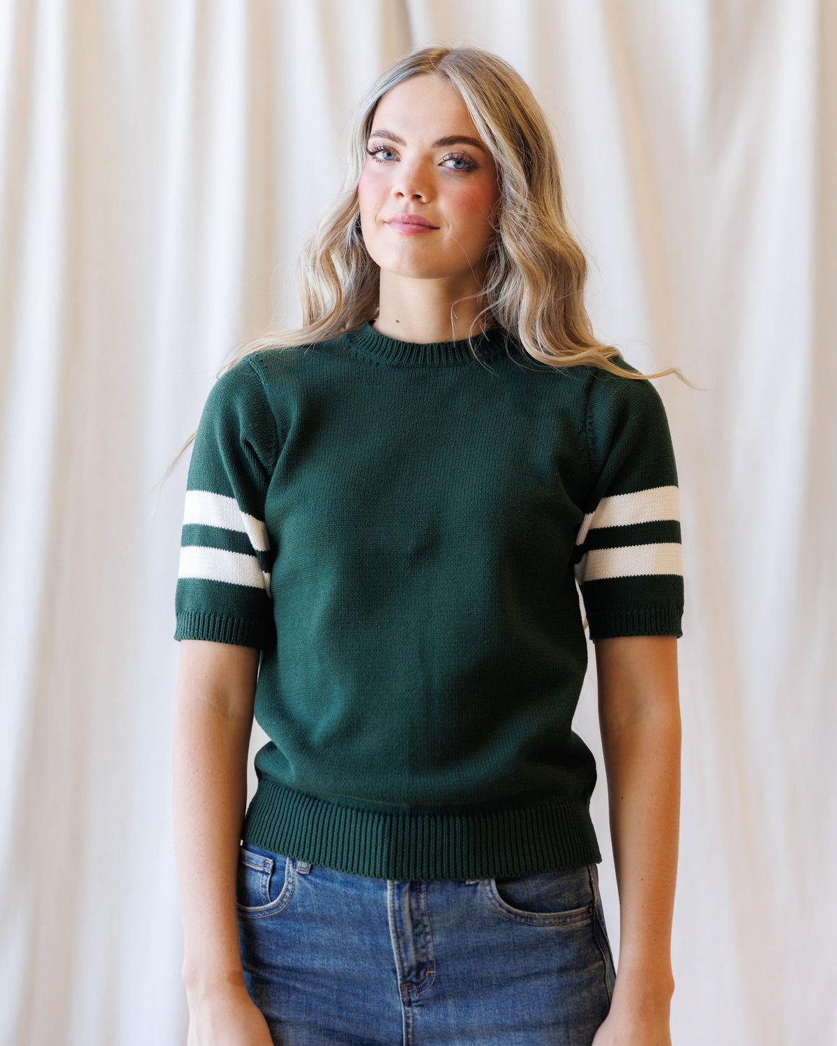 Downeast Team Spirit Crew sweater in cozy knit fabric, featuring a classic crew neck and team logo design.
