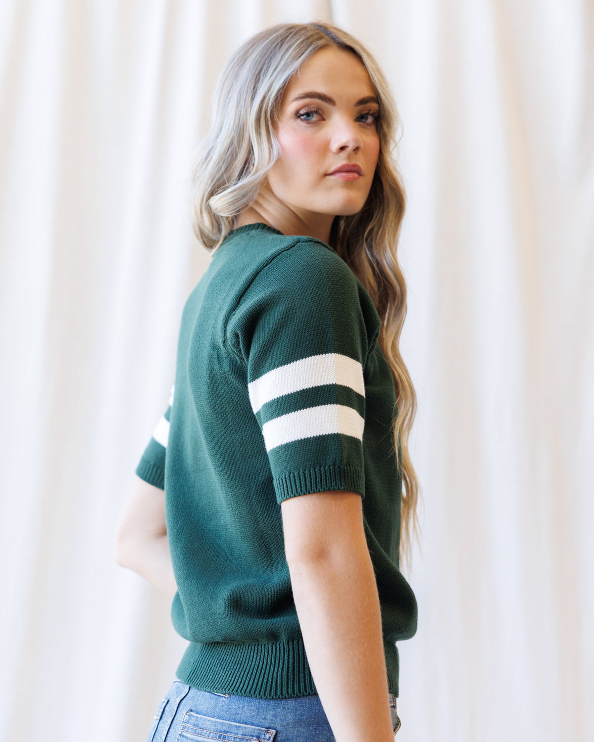 Downeast Team Spirit Crew sweater in vibrant colors, featuring a cozy knit design and casual fit, perfect for team events.