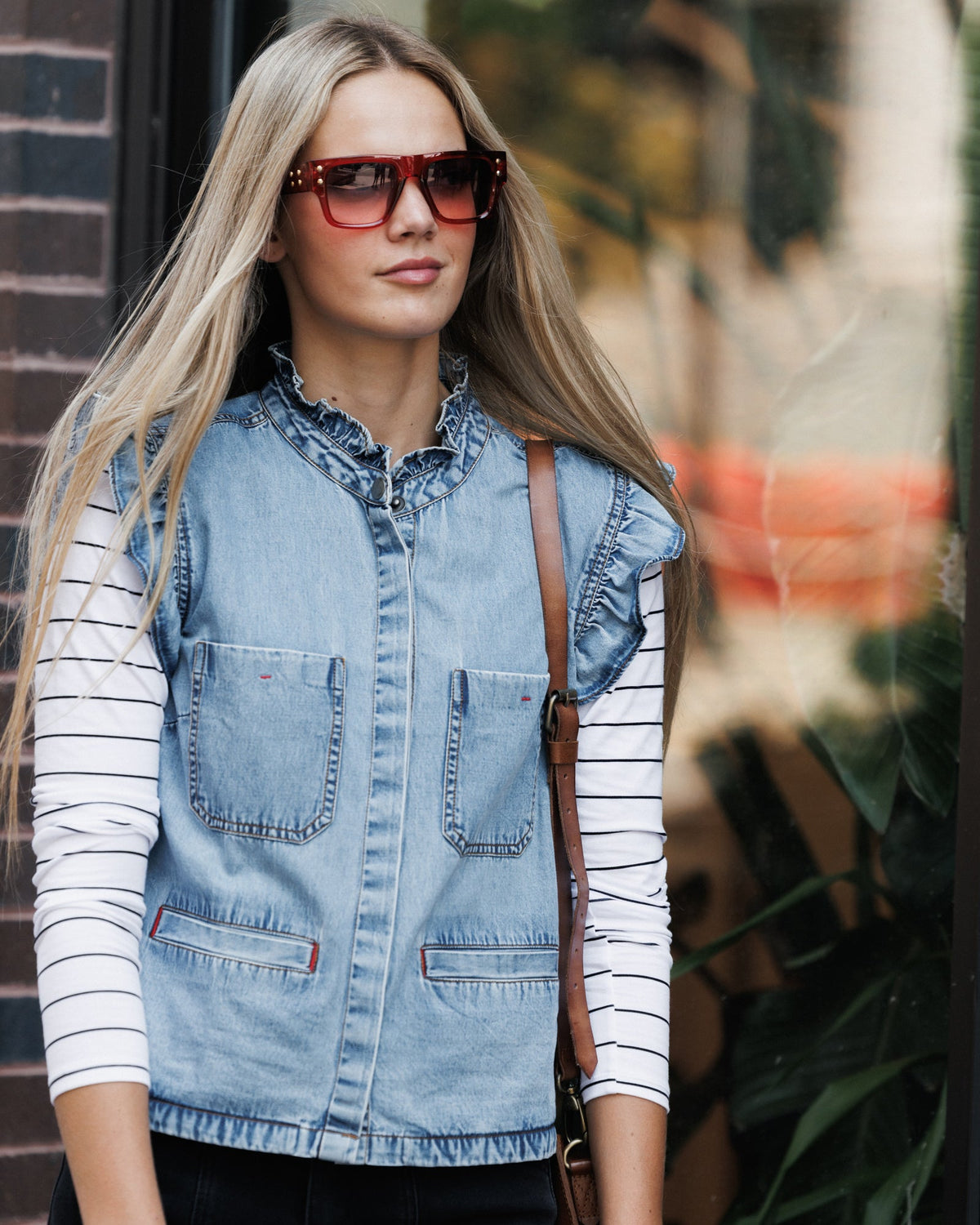 Downeast day-to-day denim vest, casual outerwear, shown on a hanger with front pockets and classic blue denim fabric.