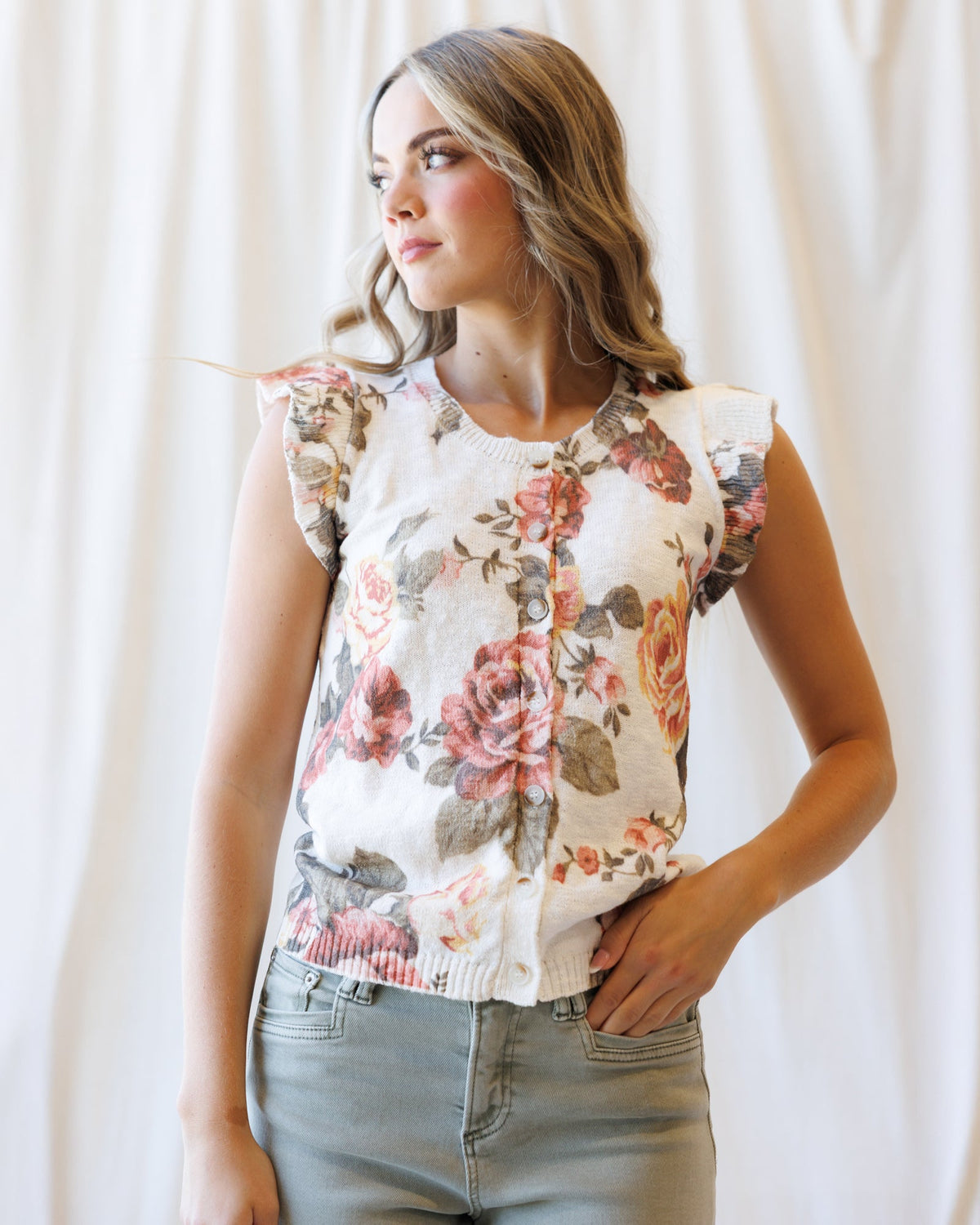 Downeast Good Call cardigan sweater in soft knit fabric, displayed on a hanger with a button-up front and cozy fit.
