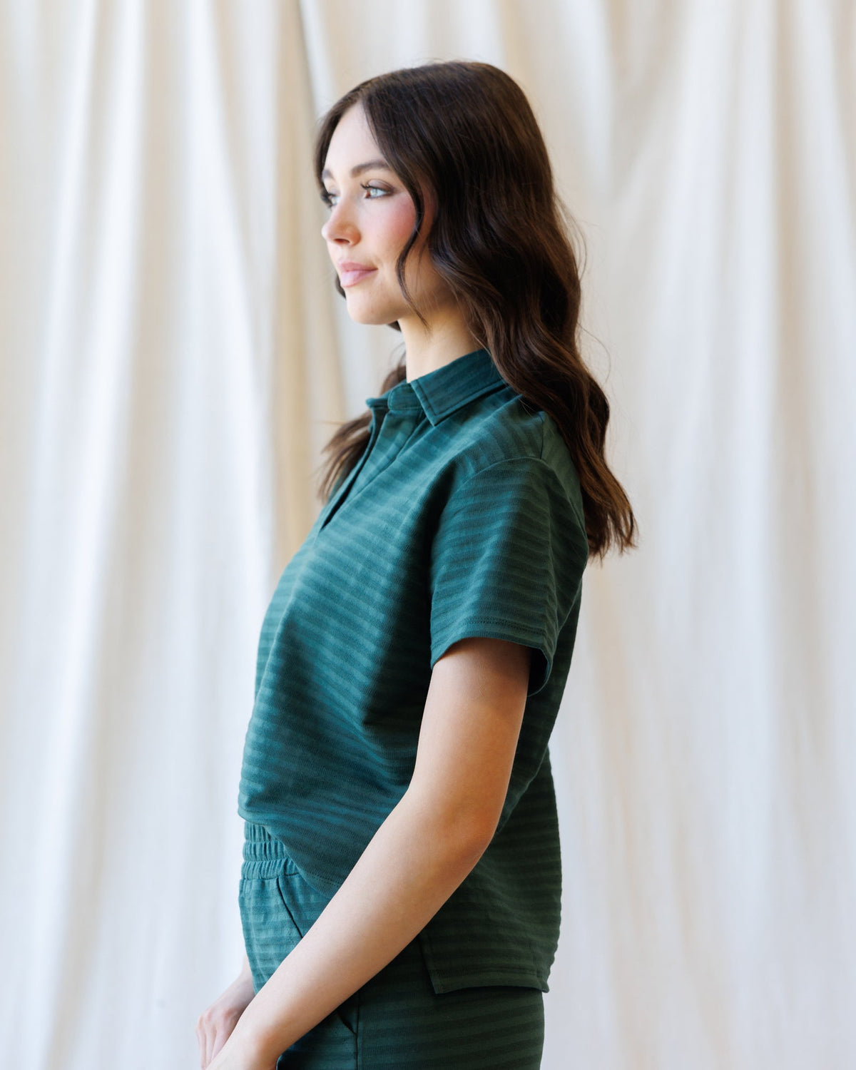 Downeast Du Jour Polo top in vibrant color, featuring classic collar and short sleeves, displayed on a mannequin.