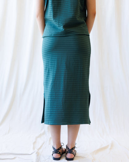 Downeast Du Jour skirt with a stylish design, shown hanging on a clothing rack in a well-lit retail setting.