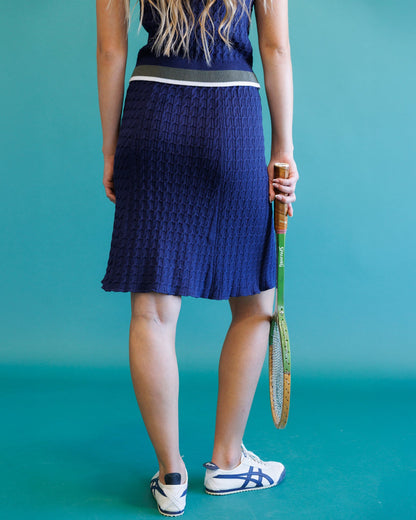 Downeast Academy Cable Skirt in neutral color, featuring cable-knit design and fitted waist, perfect for casual or office wear.