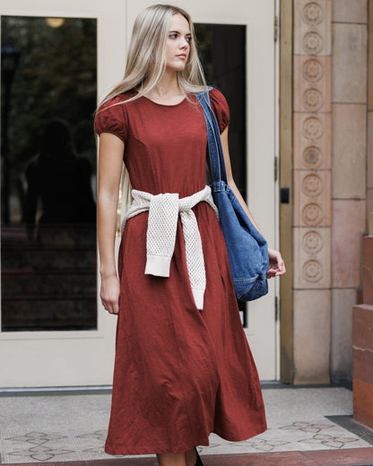 Downeast Sugar & Spice dress hanging on a hanger, featuring a floral pattern and lightweight fabric for casual wear.