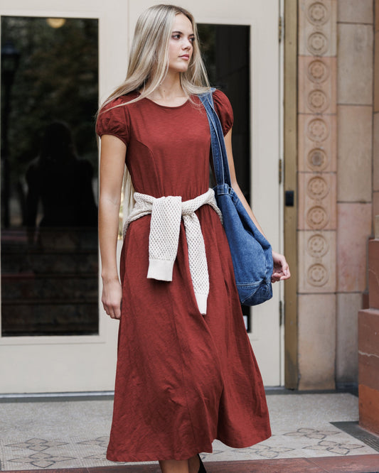 Downeast Sugar & Spice dress hanging on a hanger, featuring a floral pattern and lightweight fabric for casual wear.