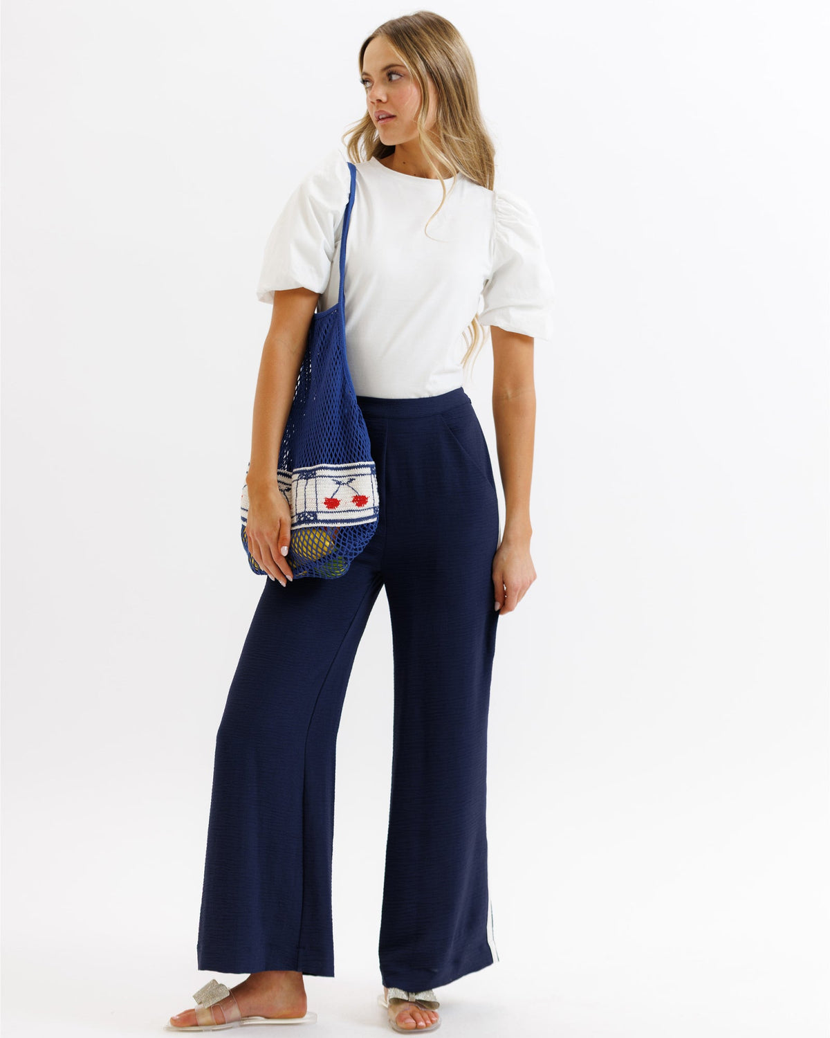 Downeast Parisian pants in neutral fabric, showcasing a stylish, tailored design with waistband and front pockets.
