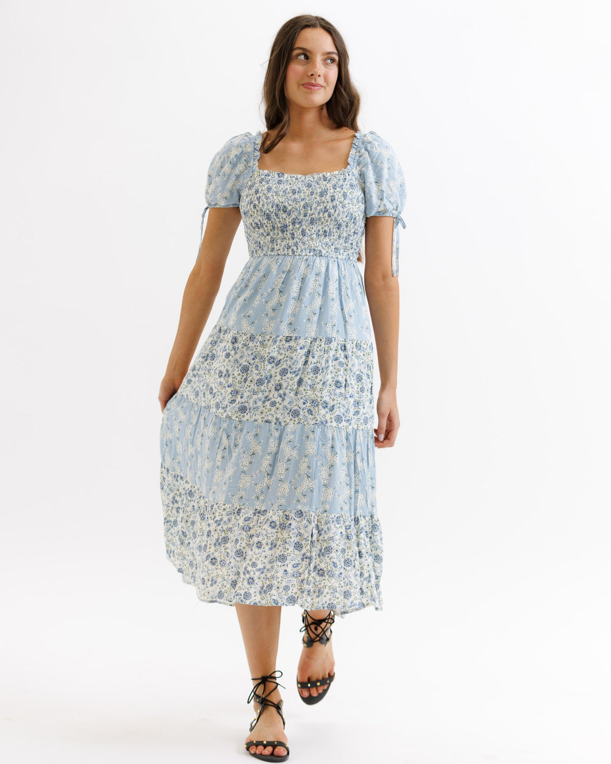 Downeast Fresh Bouquet dress displayed on a hanger, showcasing the floral pattern and lightweight fabric of the dress.