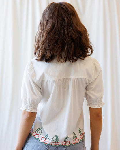 Cherry Cute Button Down top by Downeast featuring a cherry print, long sleeves, and classic collar for a stylish casual look.