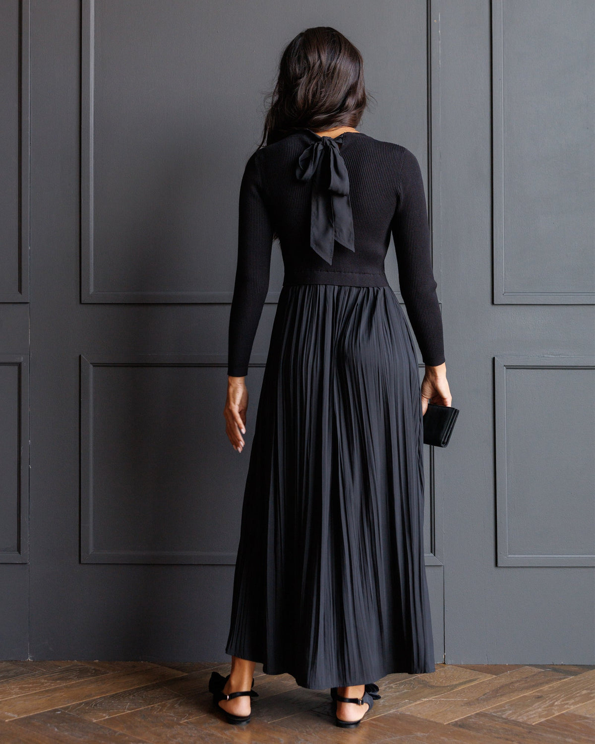 Downeast Soho satin dress displayed on a hanger, showcasing its smooth fabric and elegant design.
