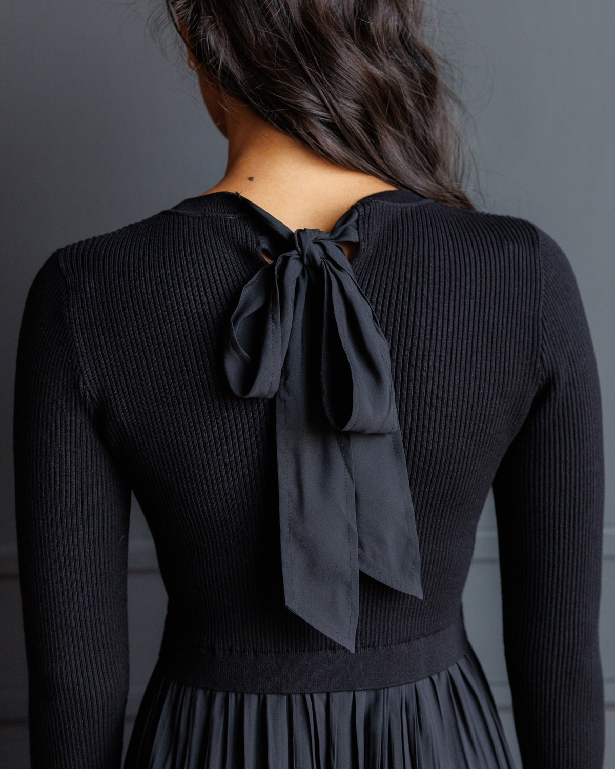 Downeast Soho satin dress featuring a sleek design, smooth fabric, and elegant fit, displayed on a mannequin.