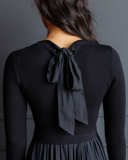 Downeast Soho satin dress featuring a sleek design, smooth fabric, and elegant fit, displayed on a mannequin.