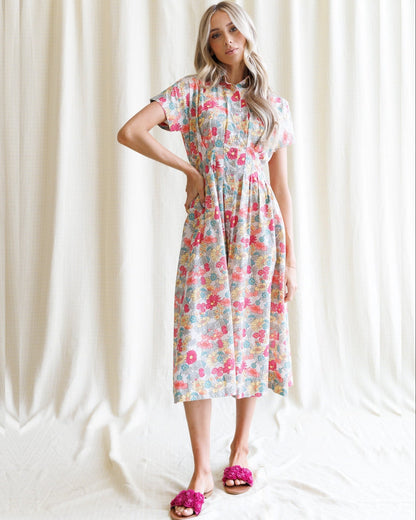 Downeast pleated shirtdress featuring a button-up front, collar, and soft fabric, shown on a hanger.