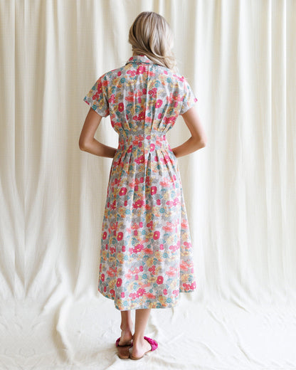 Downeast pleated shirtdress with long sleeves and button front, stylish and flowy for casual or semi-formal wear.