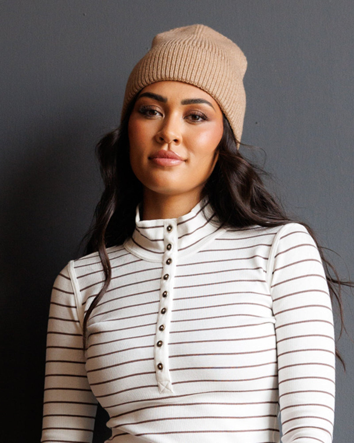 Downeast Alpine Beanie hat in cozy knit with folded brim and brand logo, perfect for cold weather.