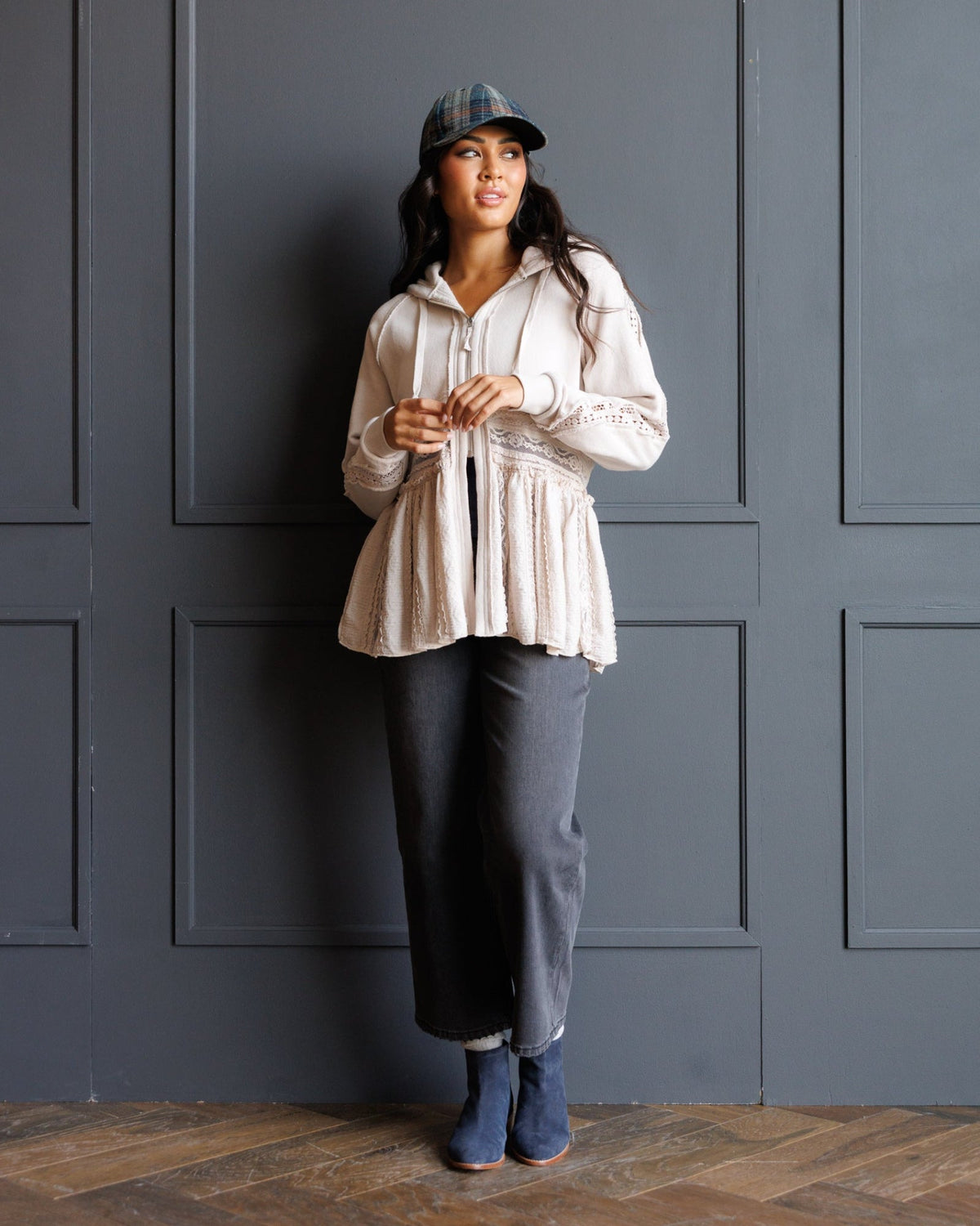 Downeast Hometown Hoodie, cozy outerwear with a front pocket and hood, displayed on a hanger against a neutral background.