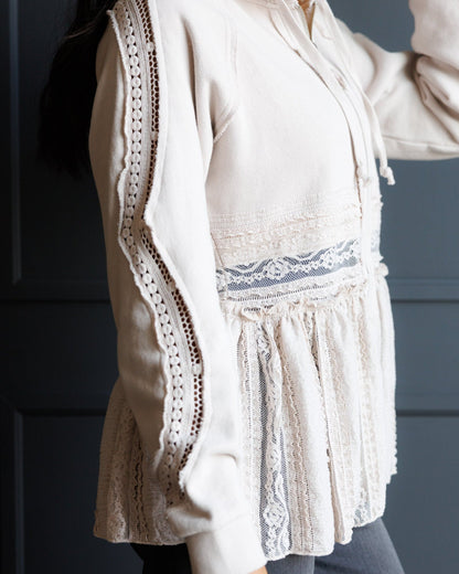 Downeast Hometown Hoodie, a cozy outerwear piece in soft fabric with a front pocket and hood, displayed on a hanger.