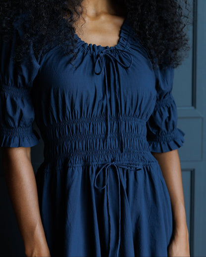 Downeast Long Way Home Dress in Blue Nights, showing a flowy, sleeveless dress with a relaxed fit and elegant neckline.