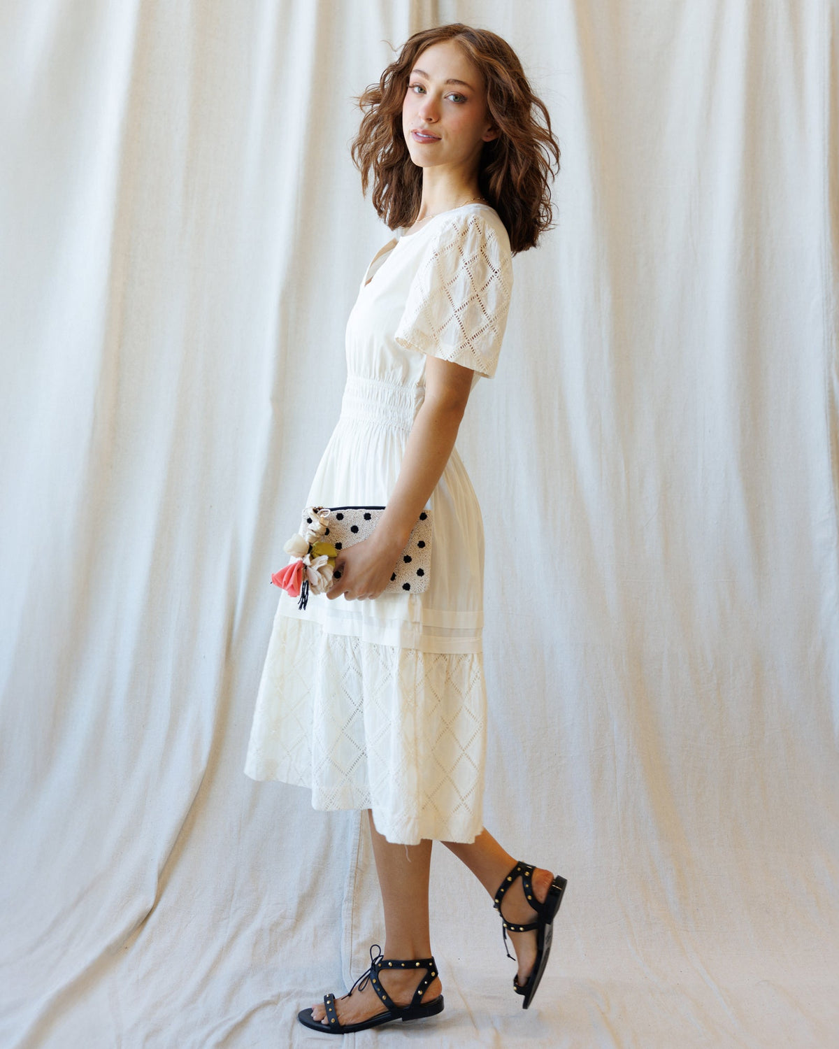 Downeast Icon Demi Lace Dress displayed on a hanger, featuring intricate lace details and a classic fit for elegant occasions.