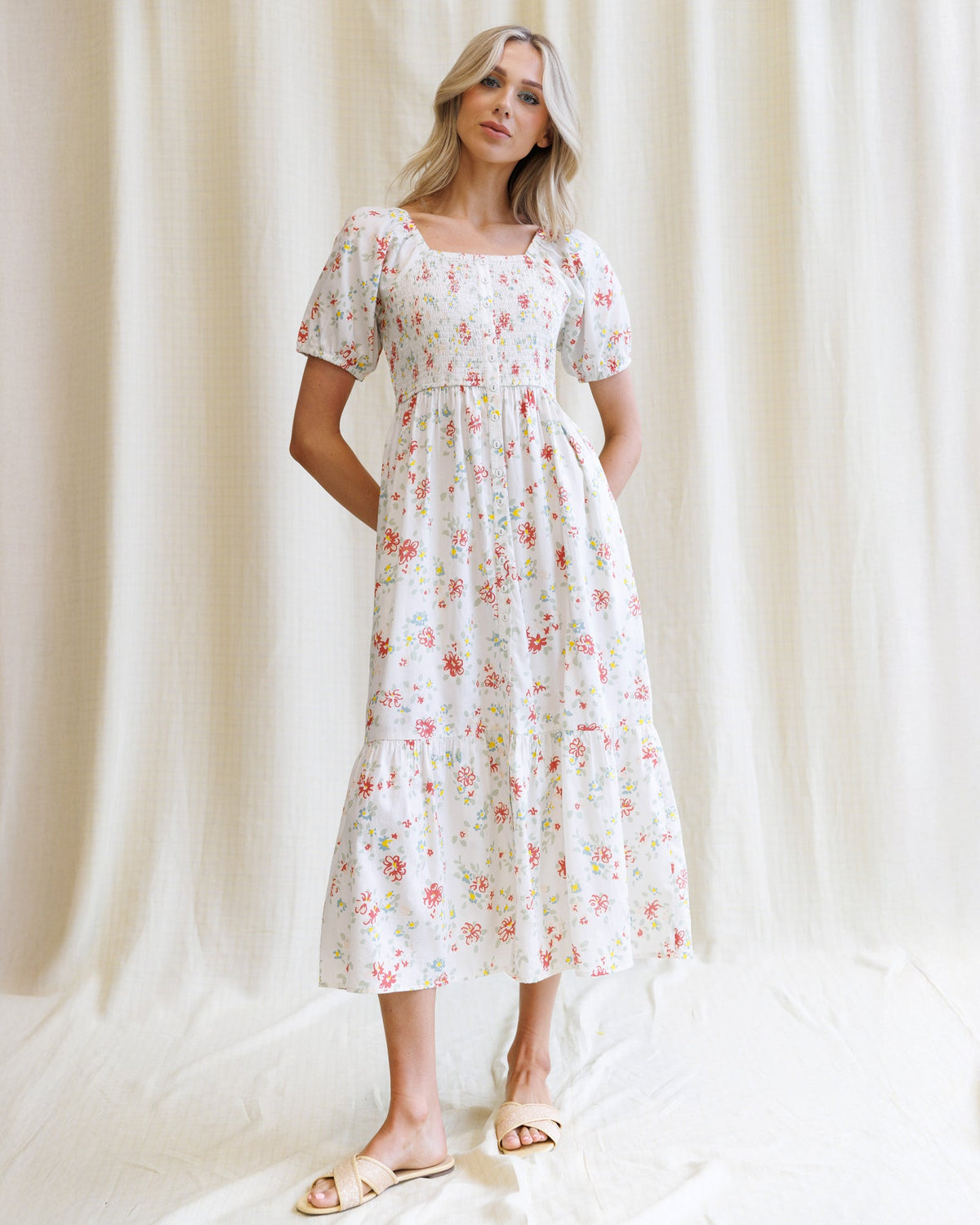 Downeast High Tea Dress in floral print, lightweight fabric, with a fitted bodice and flowing skirt, perfect for elegant occasions.